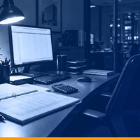 A property management desk after hours with a printed tenant ledger and a spreadsheet on screen, lit by a single lamp, under a Kardin navy gradient overlay.